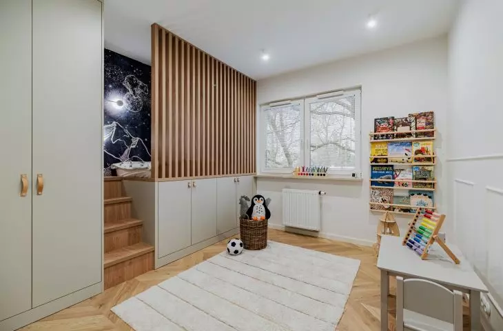 The bed was placed above the cabinets