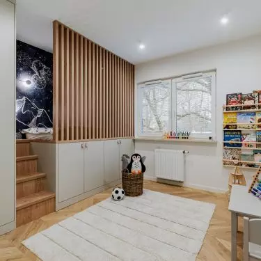 The bed was placed above the cabinets
