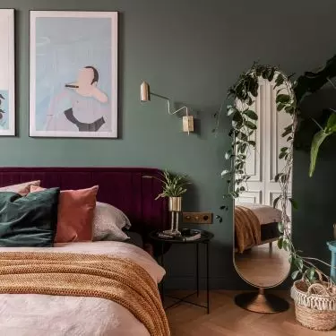 In the bedroom stood a burgundy bed
