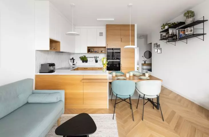 The interior features Scandinavian minimalism enriched with colorful accents