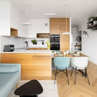 The interior features Scandinavian minimalism enriched with colorful accents