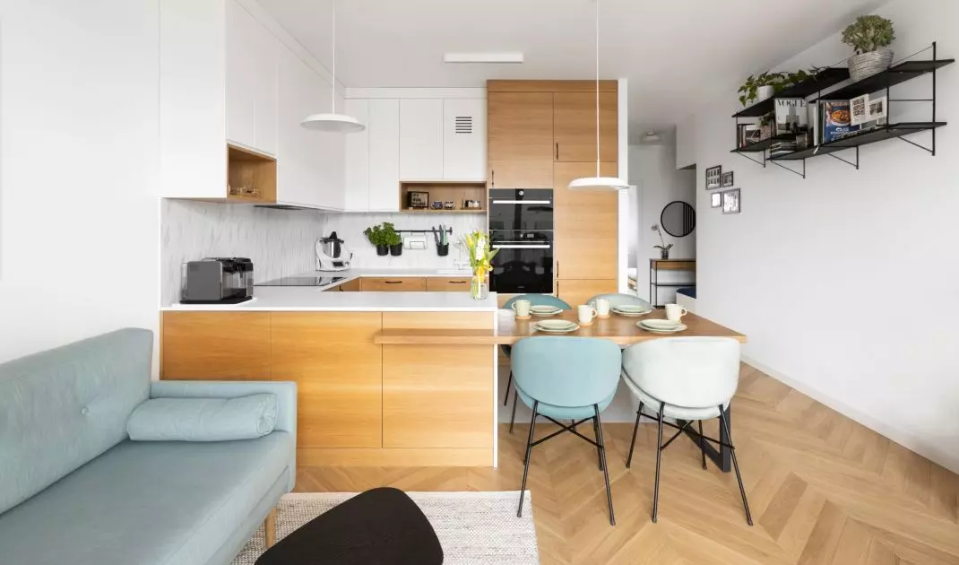 The interior features Scandinavian minimalism enriched with colorful accents