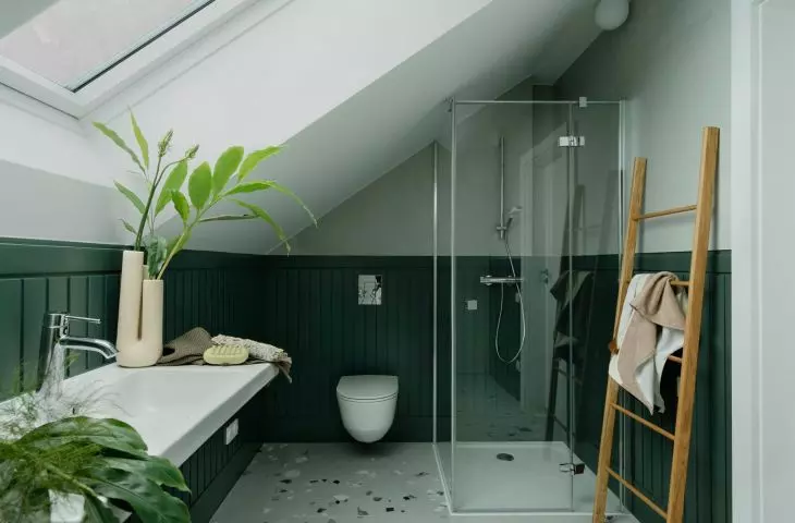 The bathroom is located in the attic