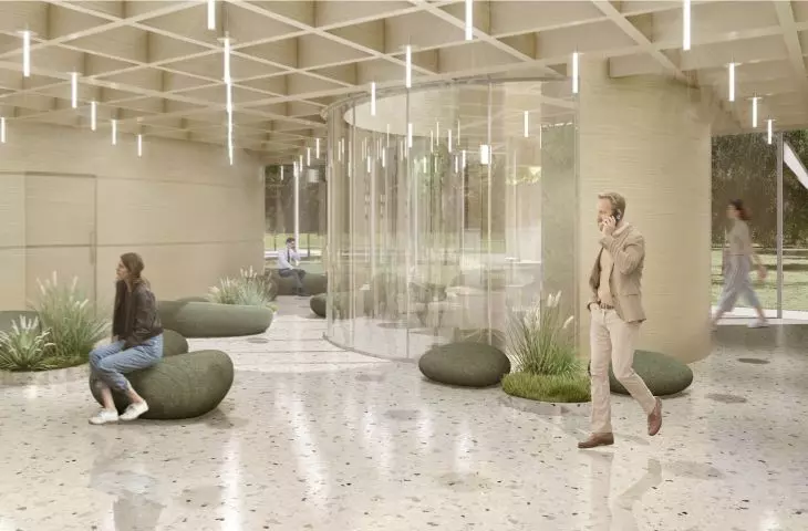 Reprezentacyjne lobby, zielona ściana i siedziska w formie kamieni