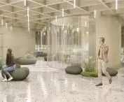 Reprezentacyjne lobby, zielona ściana i siedziska w formie kamieni