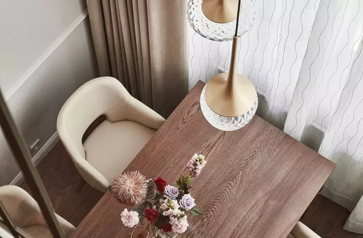 Above the table is a striking lamp with crystal shades