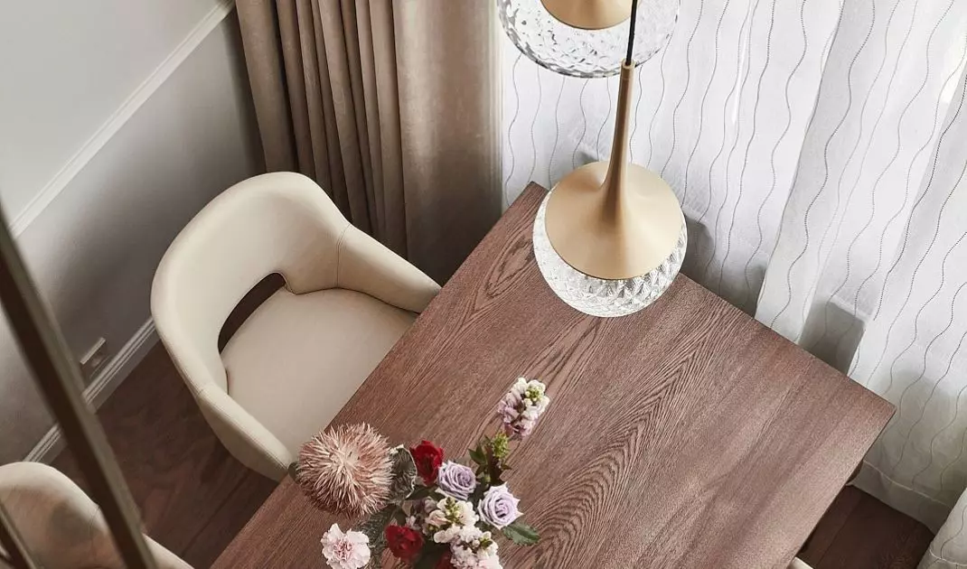 Above the table is a striking lamp with crystal shades