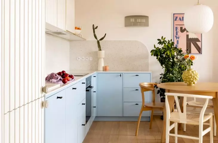 the project began with a vision of a kitchen with a dining room - the lower cabinets in blue are juxtaposed with the white of the rest of the furniture