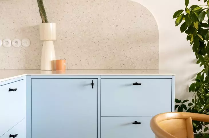 a small shelf above the kitchen countertop