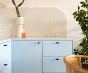 a small shelf above the kitchen countertop