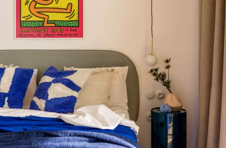 a distinctive pop art piece by American artist Keith Haring was hung in the bedroom