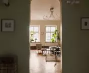 An arched passage leads to the living room