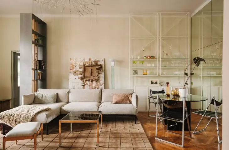 A bookcase with a collection of glassware attracts attention