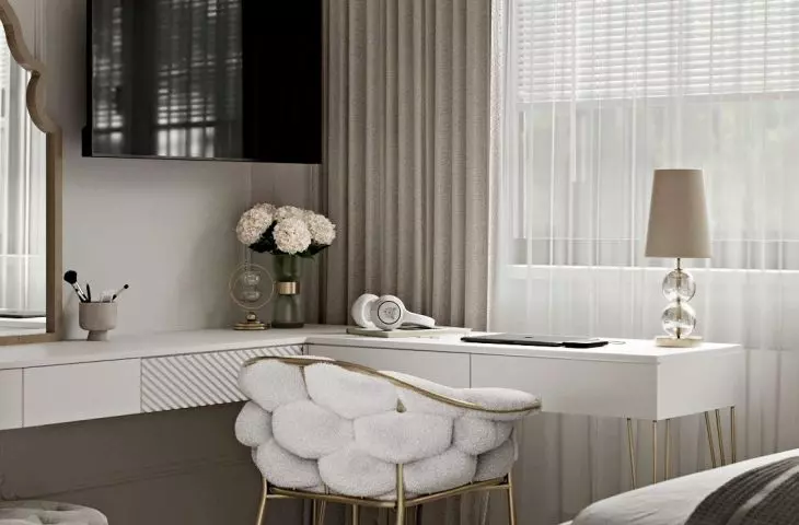 The chair refers in texture to the quilting on the wall