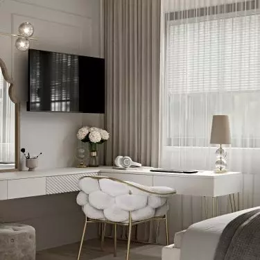 The chair refers in texture to the quilting on the wall