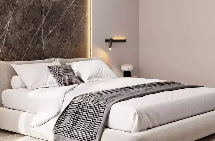 The wall behind the bed was decorated with large-format sintering