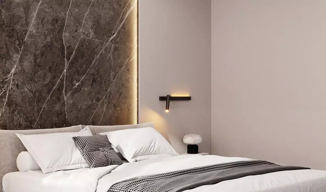 The wall behind the bed was decorated with large-format sintering