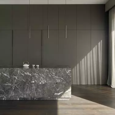 The centerpiece of the kitchen is a marble island