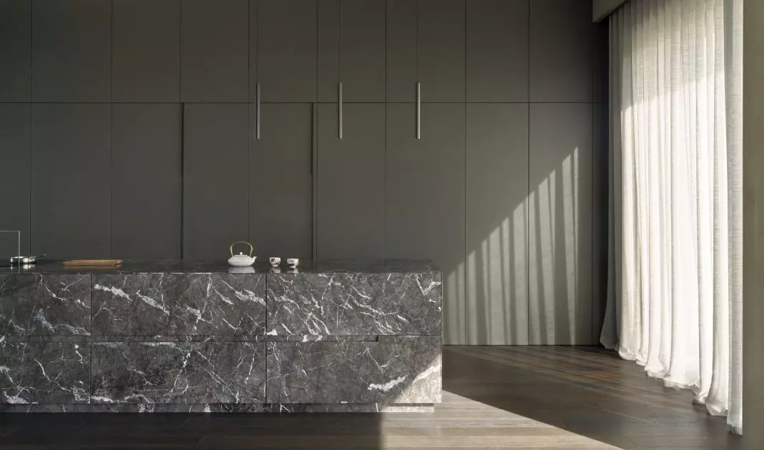 The centerpiece of the kitchen is a marble island 