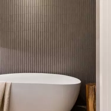 The bathroom has room for a free-standing bathtub