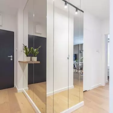 The washer and dryer were placed in a built-in cabinet in the hallway