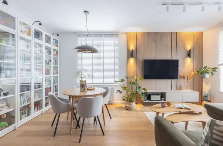 The wall with the TV was decorated with wood