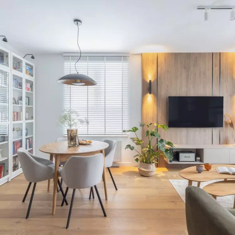 The wall with the TV was decorated with wood