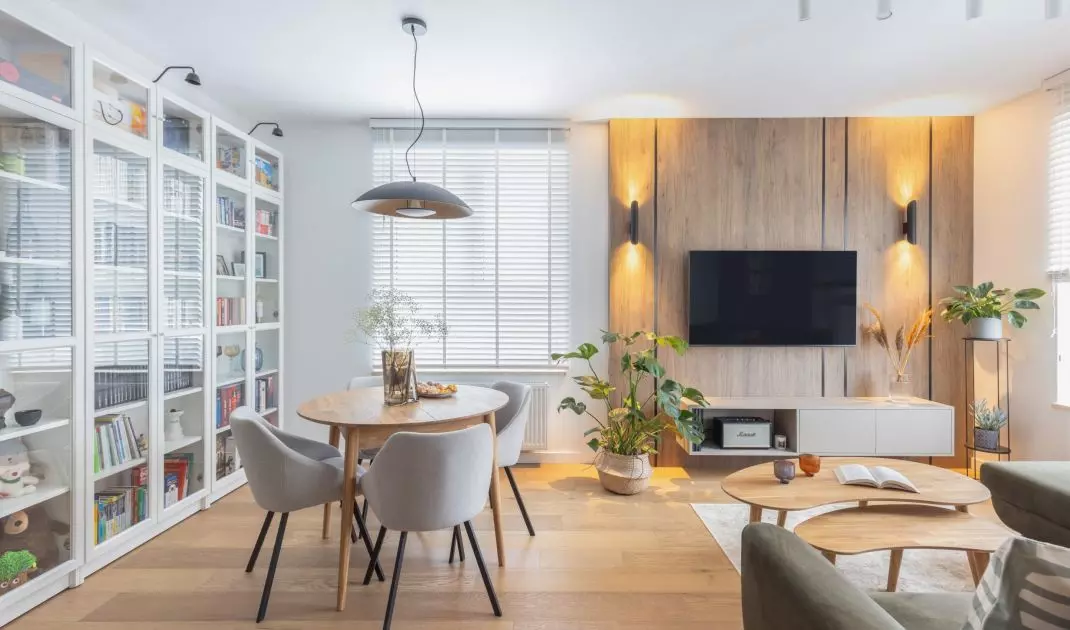 The wall with the TV was decorated with wood