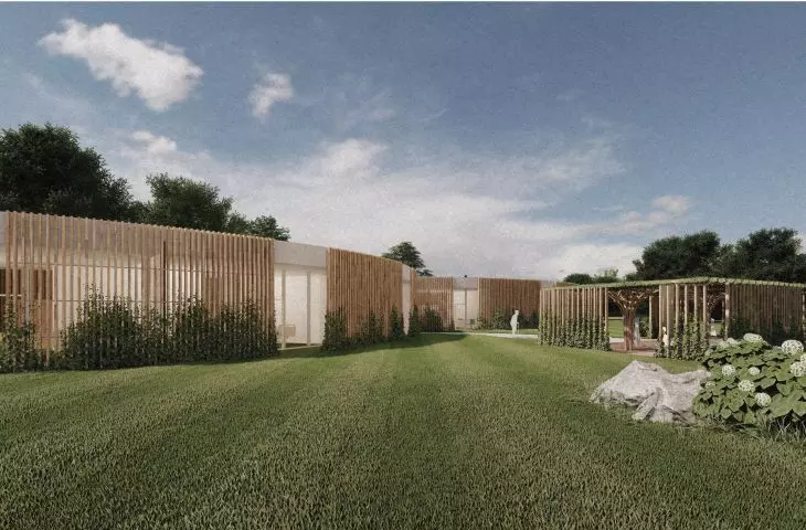 The area around the center is green and planted with meadow