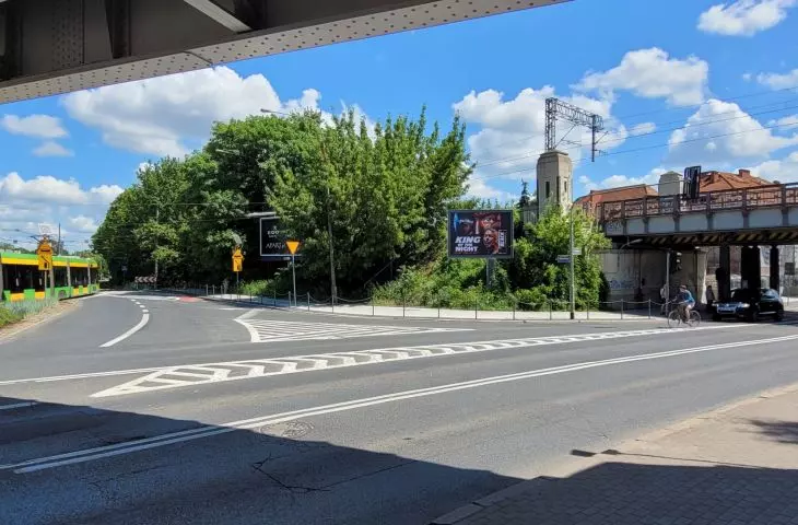 high greenery along the railway tracks in the center of Poznań