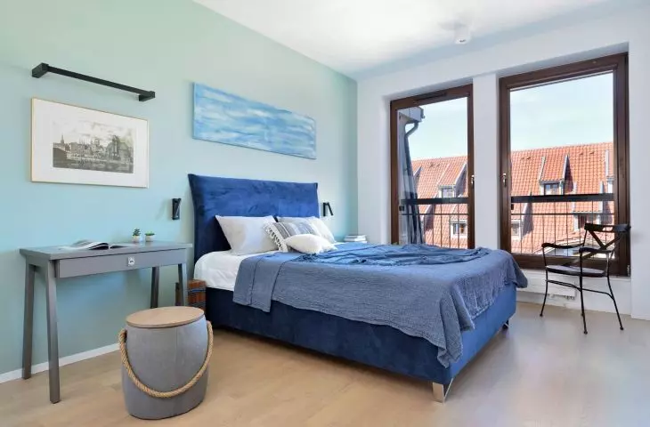 Bedroom with a painting by Magdalena Ignaczak