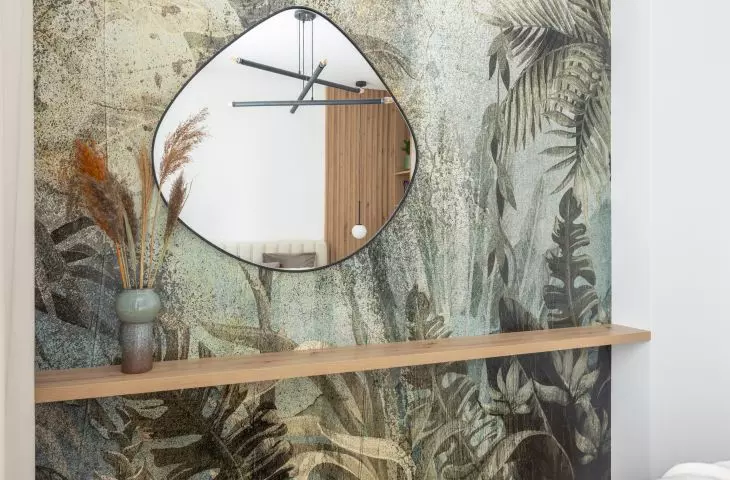 The wall opposite the bed was decorated with wallpaper