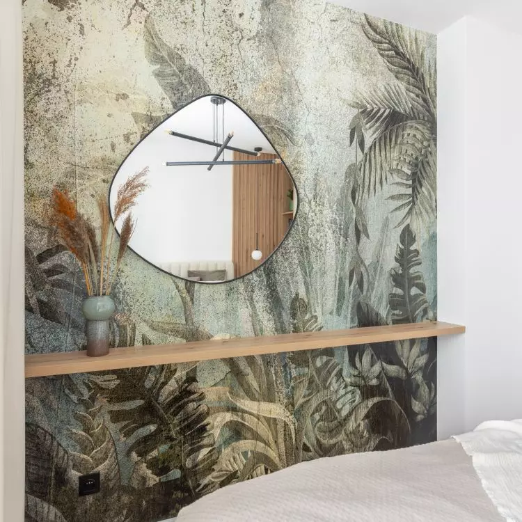 The wall opposite the bed was decorated with wallpaper