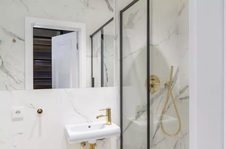 The decor of the first floor bathroom is consistent with the kitchen