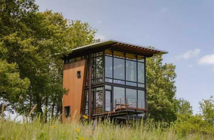 In modern wooden house designs, glass blends perfectly with the natural material.