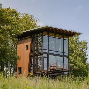 In modern wooden house designs, glass blends perfectly with the natural material.