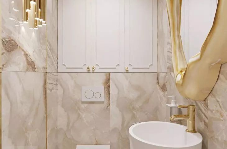 The toilet is dominated by a combination of white and gold