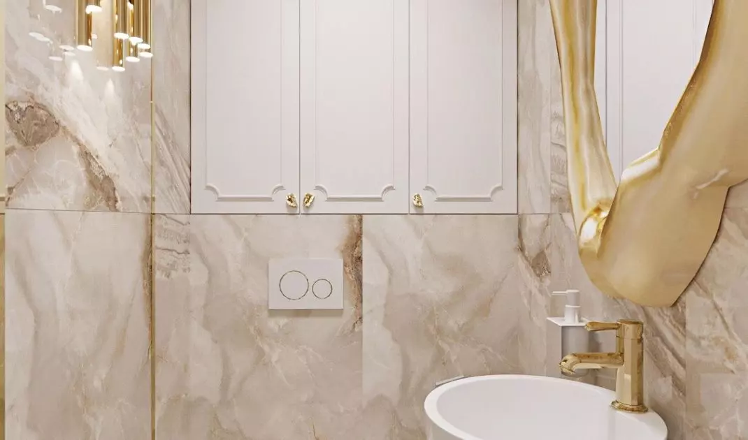 The toilet is dominated by a combination of white and gold
