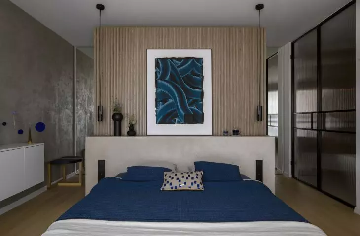 The bedroom also has a work area and a dressing room