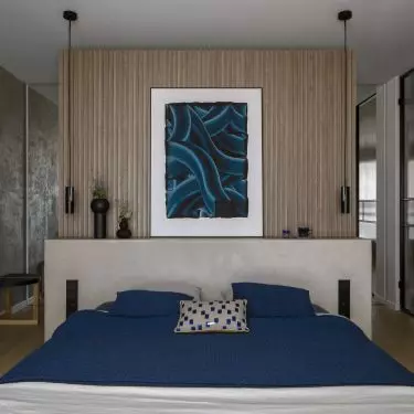 The bedroom also has a work area and a dressing room