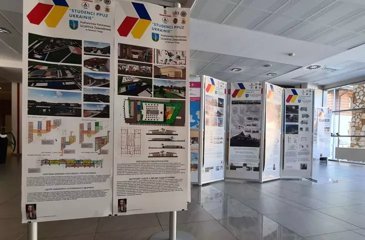 The boards showcase projects including kindergartens and a health center
