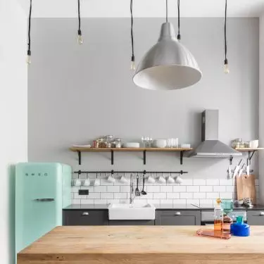 Light bulb on a long cable is the lighting characteristic of the industrial style