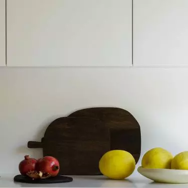White cabinetry is combined here with black cabinets