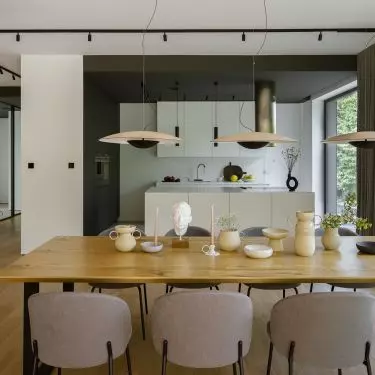 In the dining room stands a massive wooden table