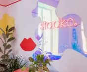 Organic elements and neon sign with the name of the premises