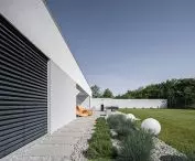 Surrounding the house is a wooded ravine
