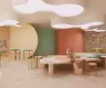 The center of the studio is a table with potter's wheels, which has curves on the edges and graphic stains on the tabletop