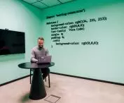 the wall is decorated with code fragments made of acoustic felt material