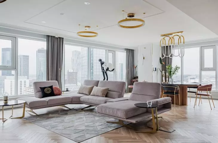 In the center of the living room is a U-shaped sofa