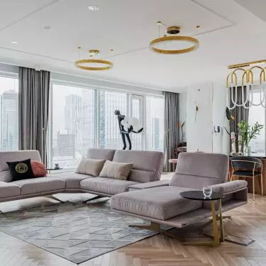 In the center of the living room is a U-shaped sofa